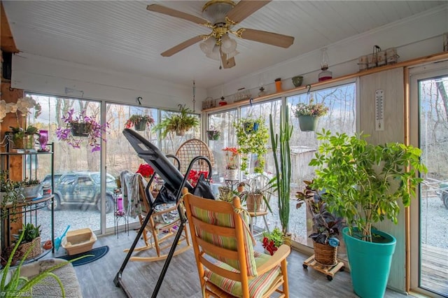 sunroom / solarium with ceiling fan and a wealth of natural light