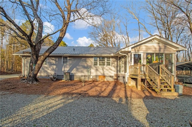 back of property featuring a sunroom