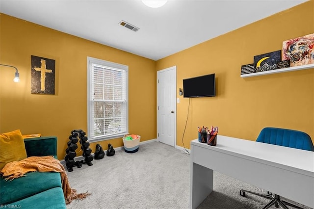 office with visible vents, baseboards, and carpet flooring