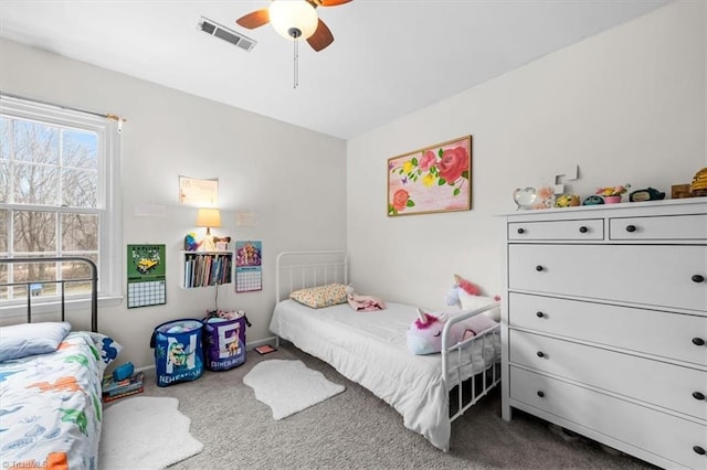 bedroom featuring visible vents, a ceiling fan, and carpet flooring