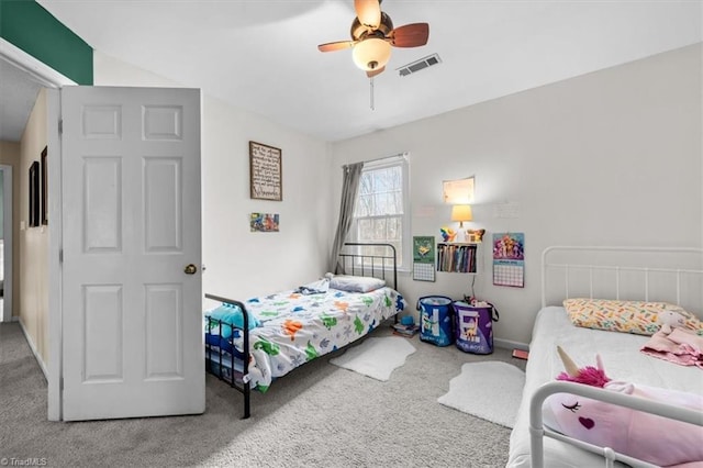 bedroom with carpet flooring, a ceiling fan, and visible vents