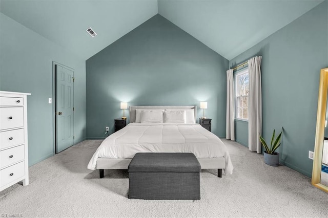 carpeted bedroom featuring visible vents and vaulted ceiling