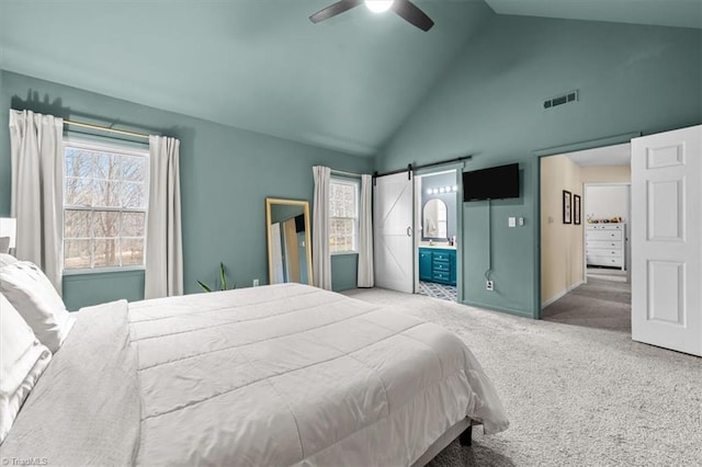 bedroom with a ceiling fan, visible vents, high vaulted ceiling, a barn door, and carpet flooring