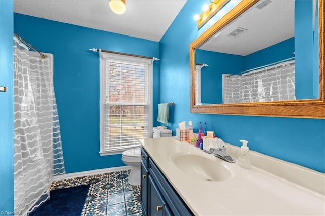 full bathroom featuring vanity, toilet, baseboards, and visible vents