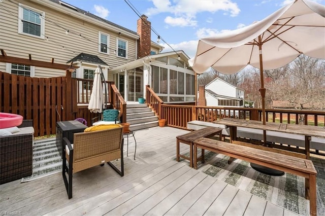 wooden terrace with a sunroom