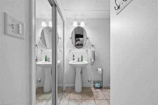 bathroom featuring tile patterned floors and baseboards