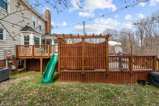 view of jungle gym featuring cooling unit and a wooden deck