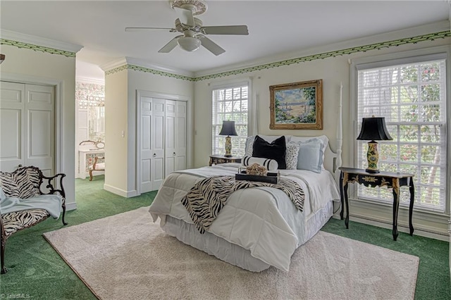 bedroom featuring multiple windows, carpet flooring, and ceiling fan