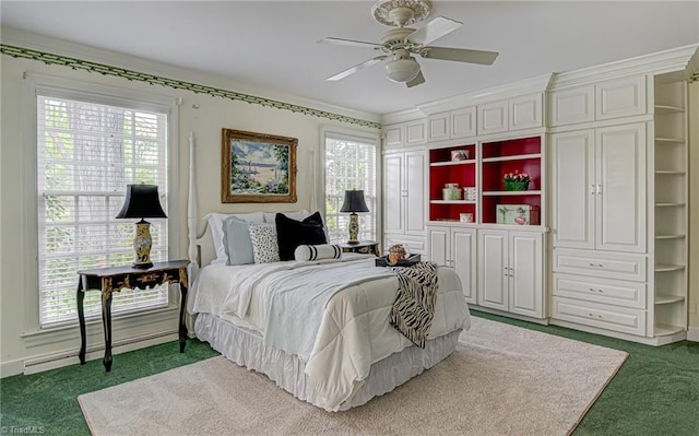 carpeted bedroom with ornamental molding, multiple windows, and ceiling fan