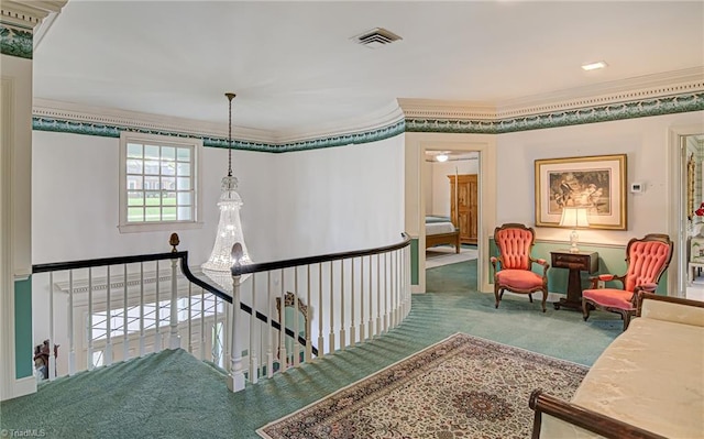 hall featuring crown molding and carpet flooring