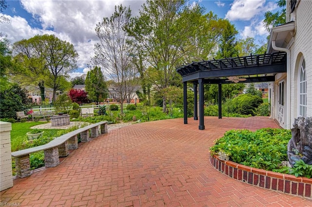 surrounding community with a pergola and a patio