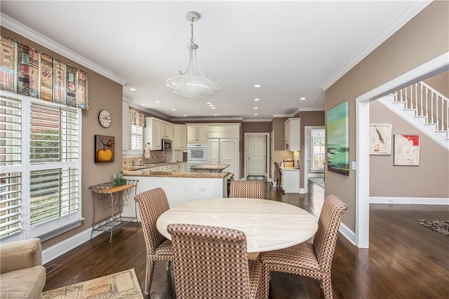 dining space featuring recessed lighting, dark wood-style floors, baseboards, and ornamental molding