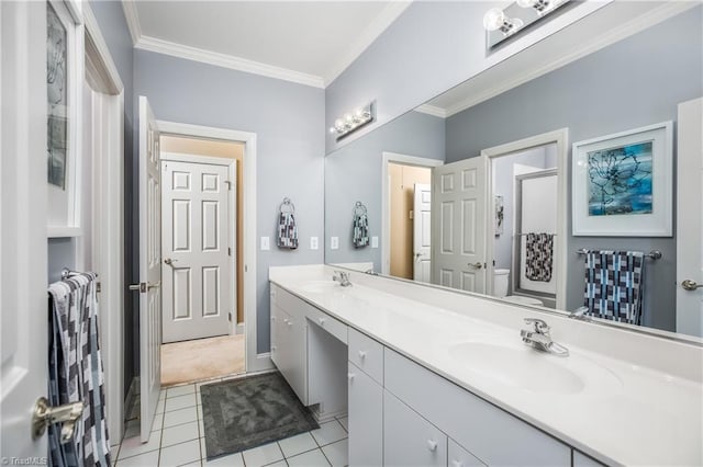 bathroom with double vanity, ornamental molding, a shower with shower door, and a sink