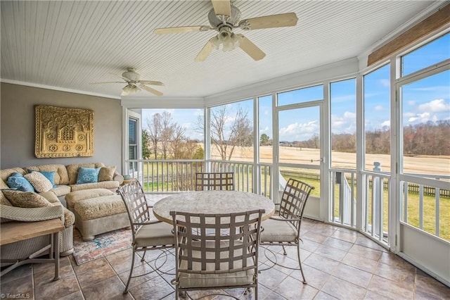 sunroom / solarium with ceiling fan