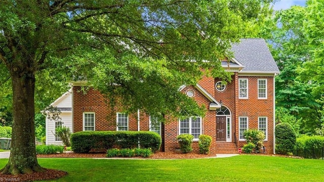 1905 Regents Park Ln, Greensboro, NC 27455 - view of front of property featuring a front lawn and brick siding