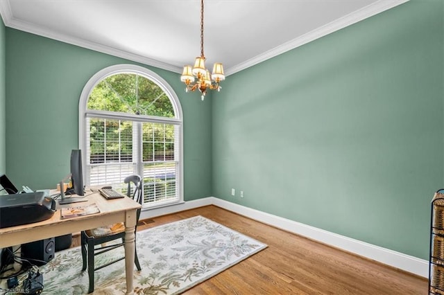 1905 Regents Park Ln, Greensboro, NC 27455 - home office with crown molding, a chandelier, baseboards, and wood finished floors