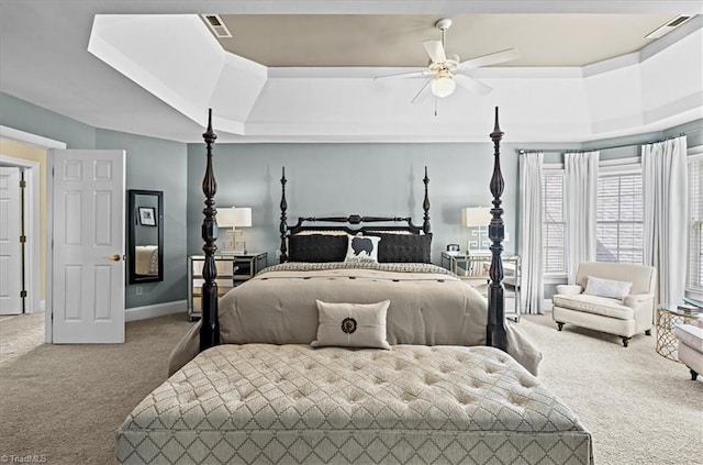 1905 Regents Park Ln, Greensboro, NC 27455 - carpeted bedroom with a raised ceiling and baseboards