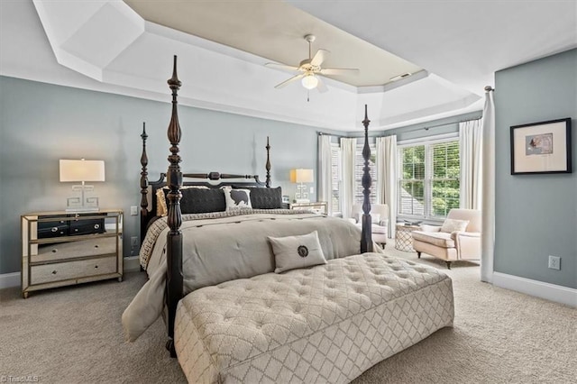 1905 Regents Park Ln, Greensboro, NC 27455 - carpeted bedroom with a tray ceiling, baseboards, and a ceiling fan