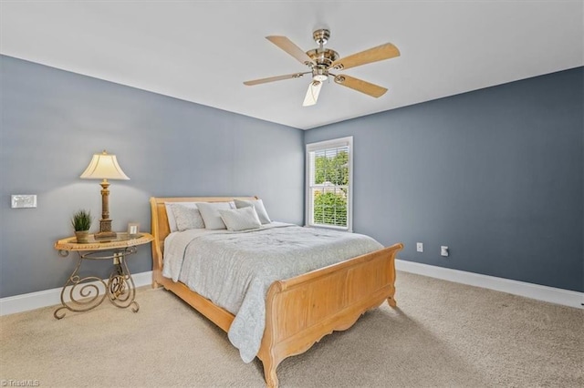 1905 Regents Park Ln, Greensboro, NC 27455 - carpeted bedroom with baseboards and ceiling fan