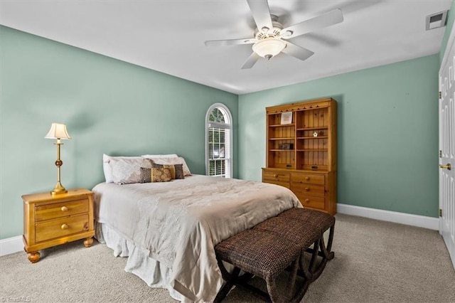 1905 Regents Park Ln, Greensboro, NC 27455 - carpeted bedroom featuring baseboards and a ceiling fan