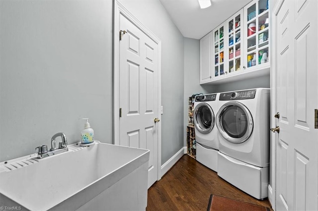 1905 Regents Park Ln, Greensboro, NC 27455 - washroom featuring independent washer and dryer, dark wood-type flooring, and baseboards