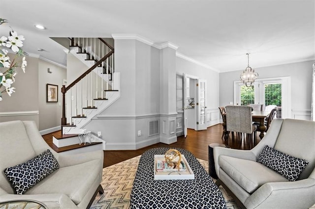 1905 Regents Park Ln, Greensboro, NC 27455 - living room featuring stairs, a chandelier, dark wood-style floors, ornamental molding, and recessed lighting