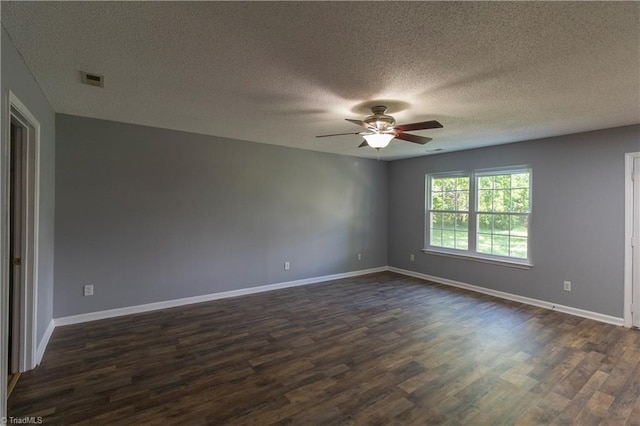 unfurnished room with ceiling fan, dark wood-style flooring, baseboards, and a textured ceiling