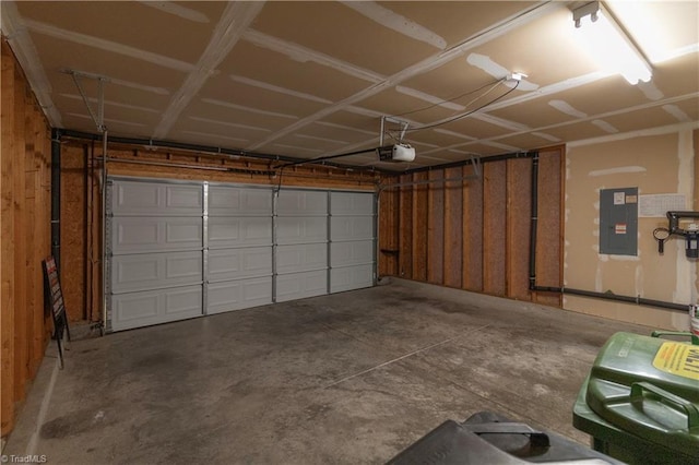 garage featuring a garage door opener and electric panel