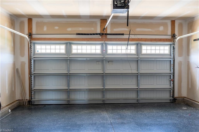 4008 Meadow Valley Dr, High Point, NC 27265 - garage with a garage door opener and baseboards