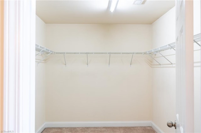 4008 Meadow Valley Dr, High Point, NC 27265 - walk in closet featuring light carpet