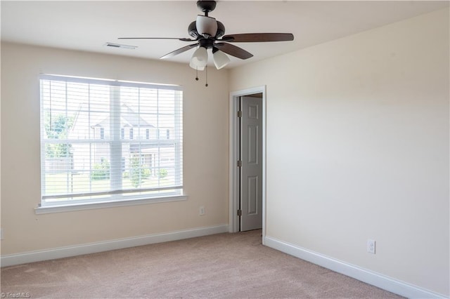 4008 Meadow Valley Dr, High Point, NC 27265 - unfurnished room with healthy amount of natural light, light colored carpet, baseboards, and a ceiling fan
