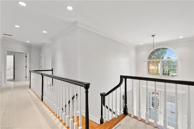 corridor with recessed lighting, visible vents, an upstairs landing, and an inviting chandelier