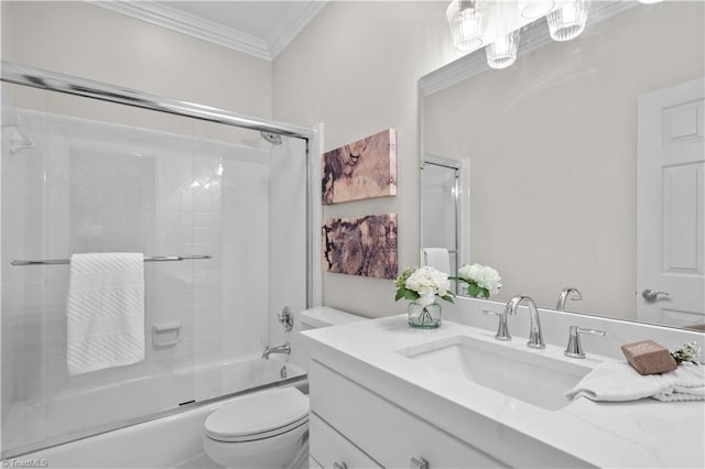 bathroom featuring ornamental molding, shower / bath combination with glass door, vanity, and toilet