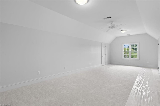 bonus room with lofted ceiling, carpet, visible vents, and baseboards