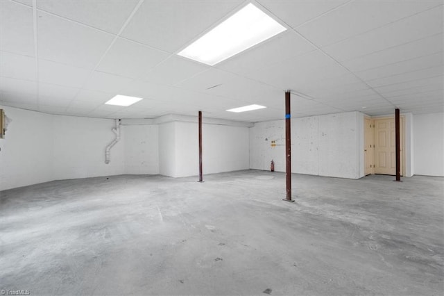 finished basement with a paneled ceiling