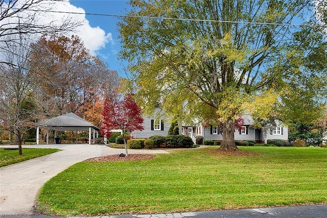 exterior space with a gazebo and a lawn