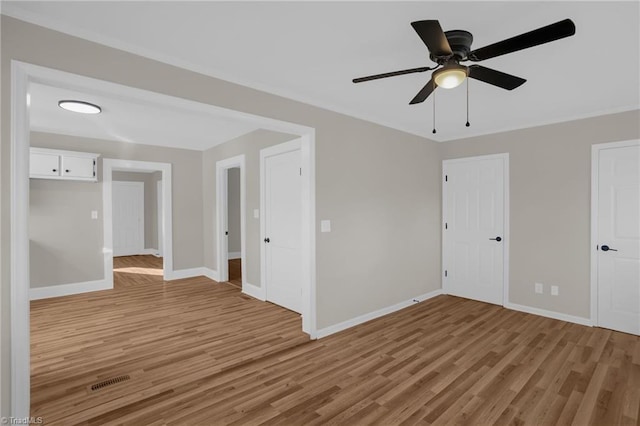 spare room with ceiling fan and light hardwood / wood-style floors