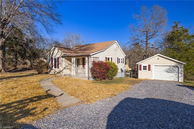 view of front of home with a garage, an outdoor structure, and a porch