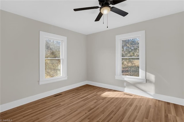 empty room with hardwood / wood-style floors