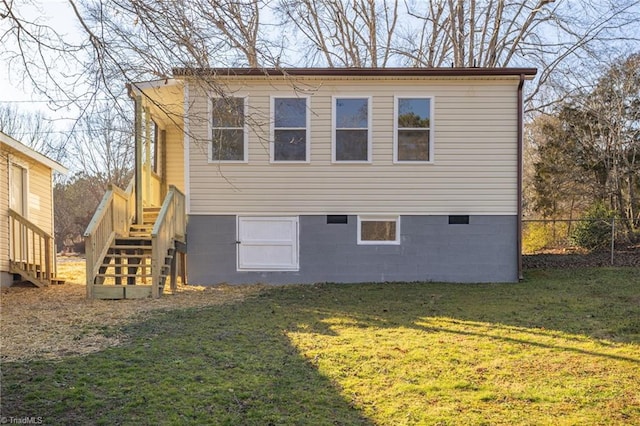 view of side of property with a lawn