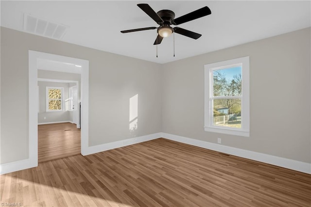 spare room featuring ceiling fan and light hardwood / wood-style flooring