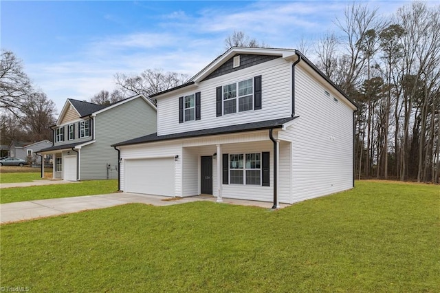 view of front property featuring a front lawn and a garage