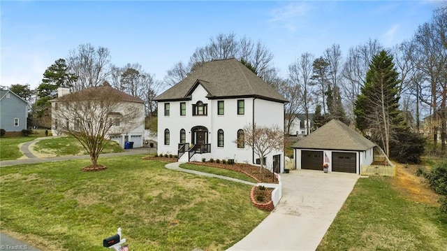 french country style house featuring a front lawn, stucco siding, and a garage