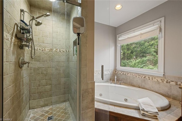 full bath with a shower stall, a tub with jets, and recessed lighting