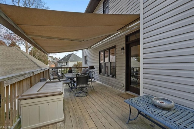 wooden deck featuring outdoor dining area