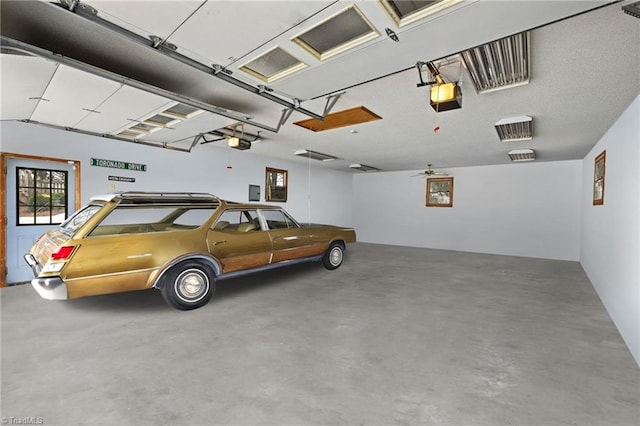 garage featuring a garage door opener