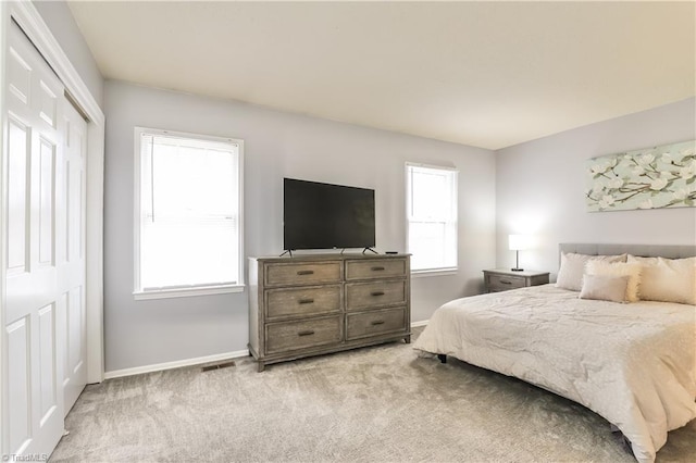 3905 Valley Ct Unit F, Winston-Salem, NC 27106 - bedroom with baseboards, carpet floors, and a closet