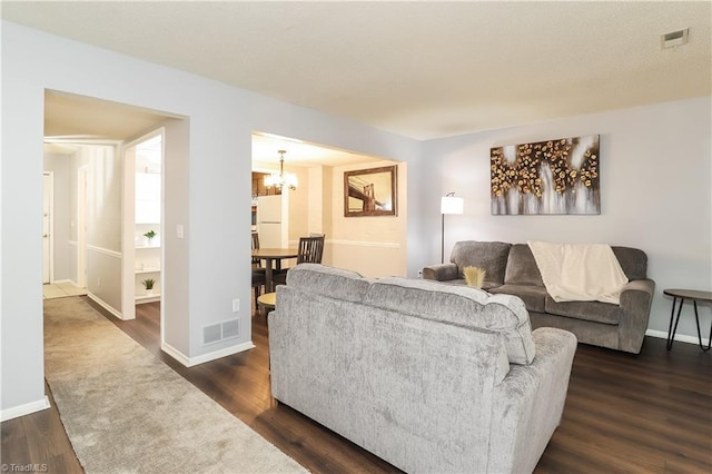 3905 Valley Ct Unit F, Winston-Salem, NC 27106 - living area with a chandelier, dark wood-style floors, and baseboards