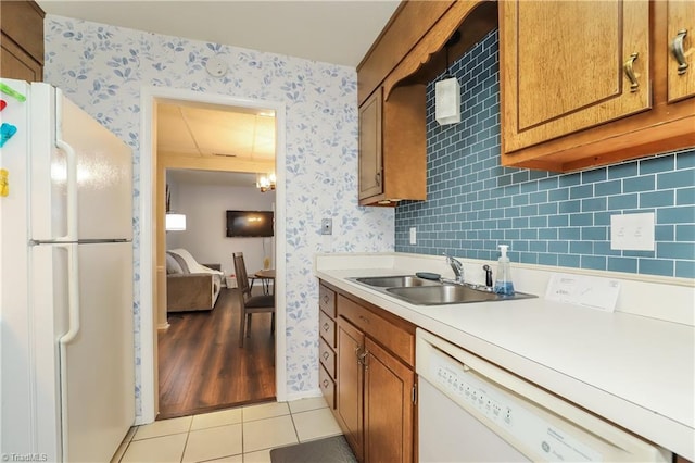 3905 Valley Ct Unit F, Winston-Salem, NC 27106 - kitchen featuring white appliances, wallpapered walls, a sink, light countertops, and light tile patterned floors