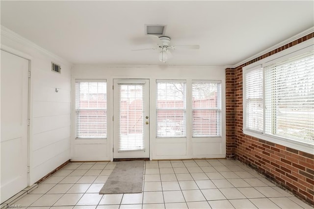 3905 Valley Ct Unit F, Winston-Salem, NC 27106 - unfurnished sunroom featuring brick wall, tile patterned floors, and ornamental molding